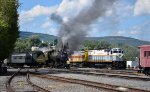 The Steamtown excursion passing by the freight train